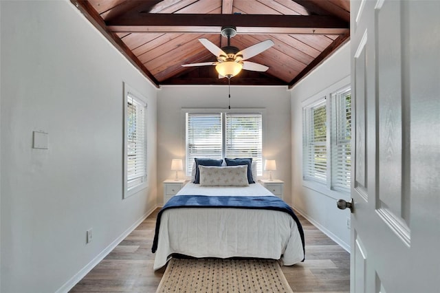 1138 Howard St, Clearwater, FL 33756 - bedroom featuring lofted ceiling with beams, baseboards, wood ceiling, a ceiling fan, and wood finished floors