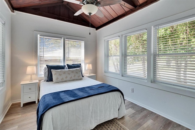 1138 Howard St, Clearwater, FL 33756 - bedroom featuring baseboards, lofted ceiling, light wood-style floors, and wooden ceiling