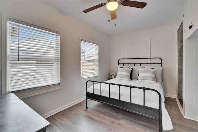 1138 Howard St, Clearwater, FL 33756 - bedroom with baseboards, ceiling fan, and wood finished floors