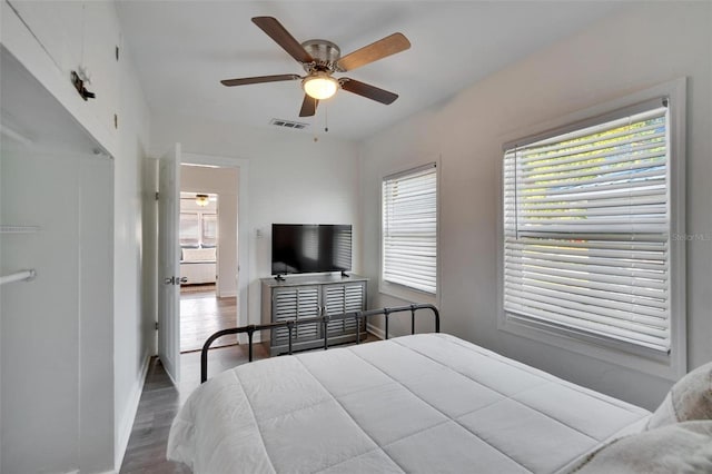 1138 Howard St, Clearwater, FL 33756 - bedroom with wood finished floors, baseboards, ceiling fan, and visible vents