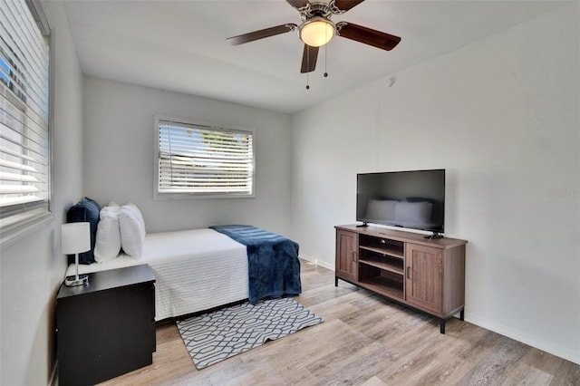 1138 Howard St, Clearwater, FL 33756 - bedroom featuring baseboards, light wood-style floors, and ceiling fan