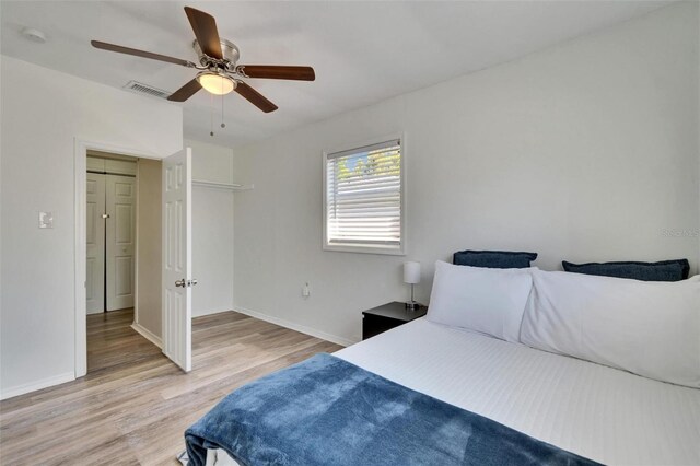 1138 Howard St, Clearwater, FL 33756 - bedroom featuring baseboards, visible vents, light wood-style flooring, and ceiling fan