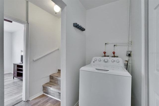 1138 Howard St, Clearwater, FL 33756 - laundry area with washer / clothes dryer, baseboards, laundry area, and wood finished floors