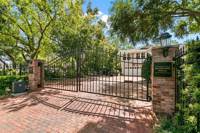 view of gate featuring fence