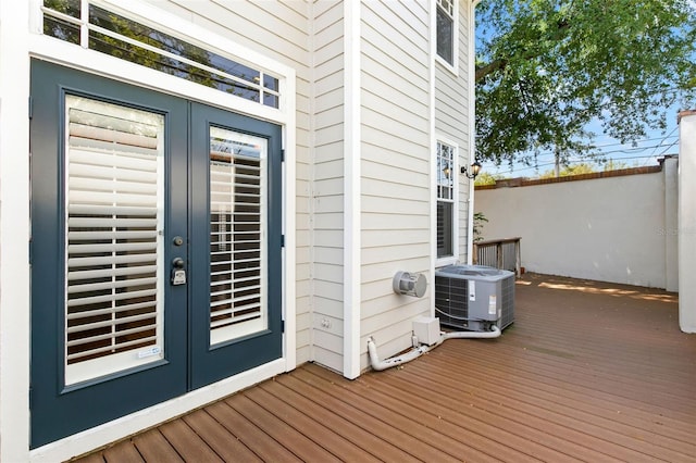 wooden deck with french doors and cooling unit