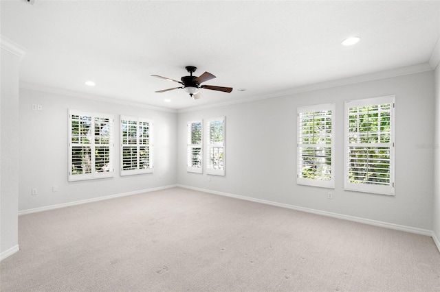 empty room featuring ornamental molding, recessed lighting, light carpet, and a ceiling fan