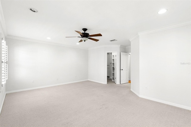 empty room featuring ceiling fan, recessed lighting, light carpet, and baseboards