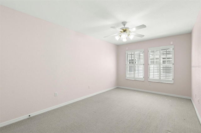 unfurnished room with carpet floors, baseboards, and ceiling fan