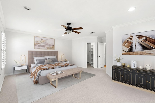 bedroom with a walk in closet, baseboards, carpet, and recessed lighting