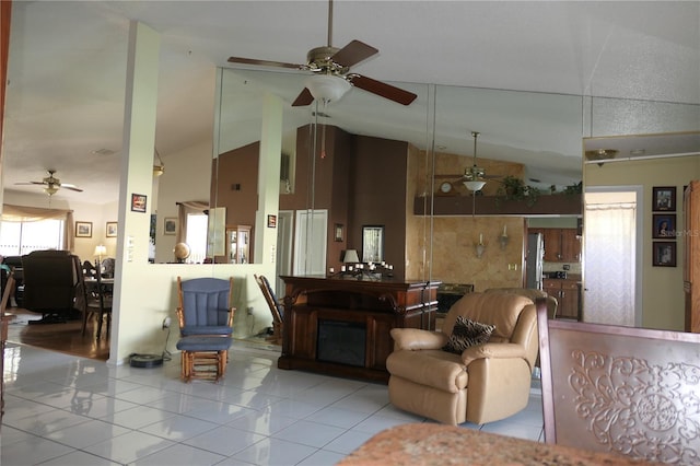 8609 Thimbleberry Ln, Tampa, FL 33635 - living area with tile patterned floors, a ceiling fan, and vaulted ceiling
