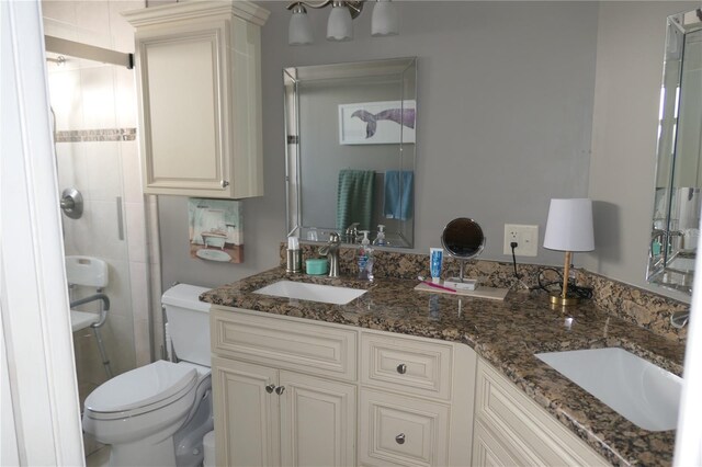 8609 Thimbleberry Ln, Tampa, FL 33635 - full bathroom featuring a shower stall, toilet, double vanity, and a sink