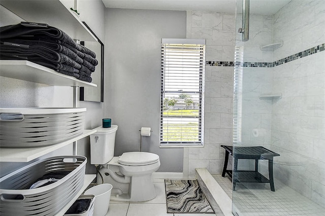10 Arbor Ln, Oldsmar, FL 34677 - bathroom with toilet, a walk in shower, marble look tiles, and baseboards