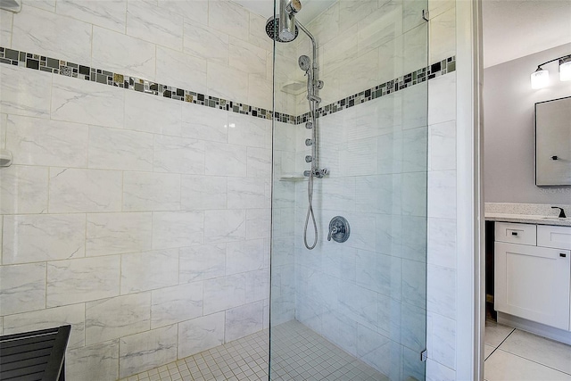 10 Arbor Ln, Oldsmar, FL 34677 - bathroom with tiled shower, vanity, and tile patterned flooring