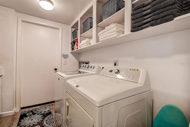 10 Arbor Ln, Oldsmar, FL 34677 - laundry room featuring separate washer and dryer and wood finished floors