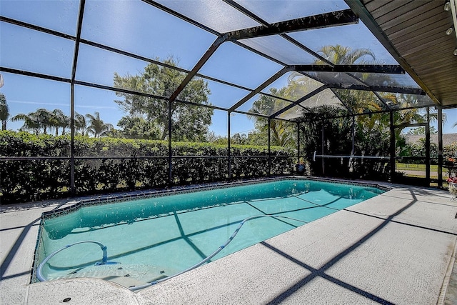 10 Arbor Ln, Oldsmar, FL 34677 - swimming pool with a patio area and glass enclosure