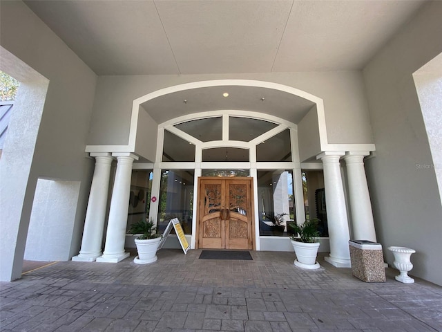10 Arbor Ln, Oldsmar, FL 34677 - property entrance with french doors and stucco siding