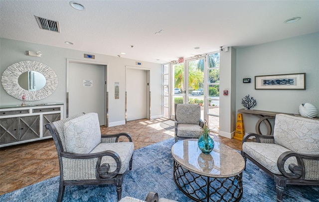4801 Osprey Dr S Unit 508, Saint Petersburg, FL 33711 - living area with elevator, baseboards, expansive windows, and visible vents