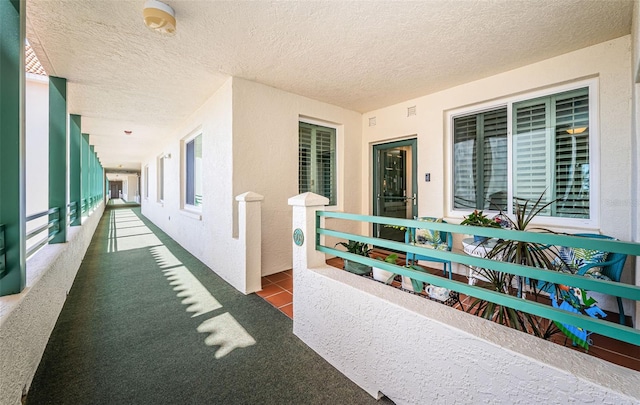 4801 Osprey Dr S Unit 508, Saint Petersburg, FL 33711 - doorway to property with a balcony and stucco siding