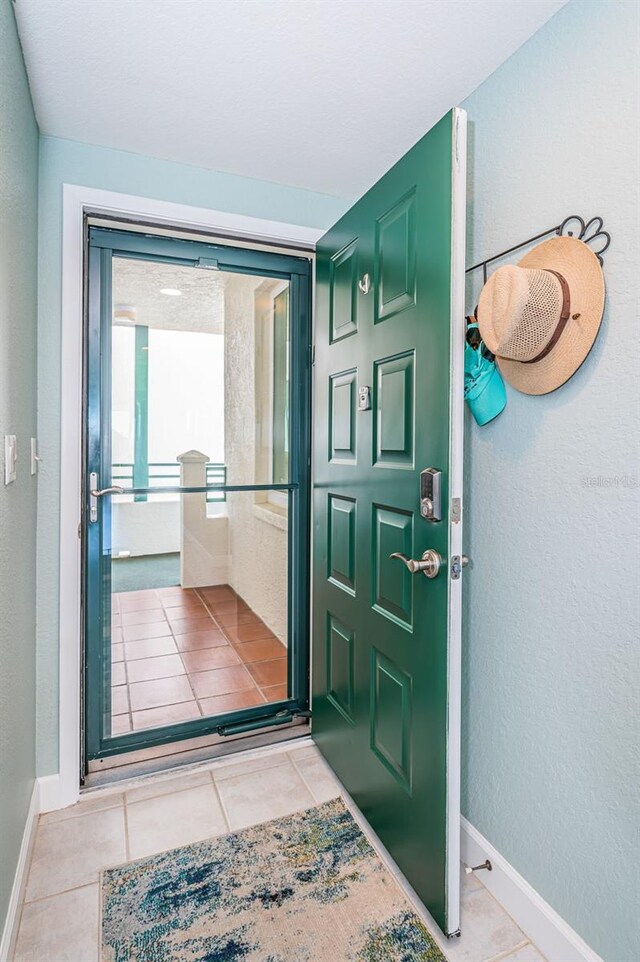 4801 Osprey Dr S Unit 508, Saint Petersburg, FL 33711 - entryway featuring baseboards and tile patterned flooring
