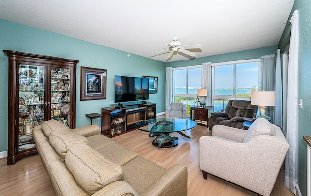 4801 Osprey Dr S Unit 508, Saint Petersburg, FL 33711 - living room featuring baseboards, wood finished floors, and ceiling fan