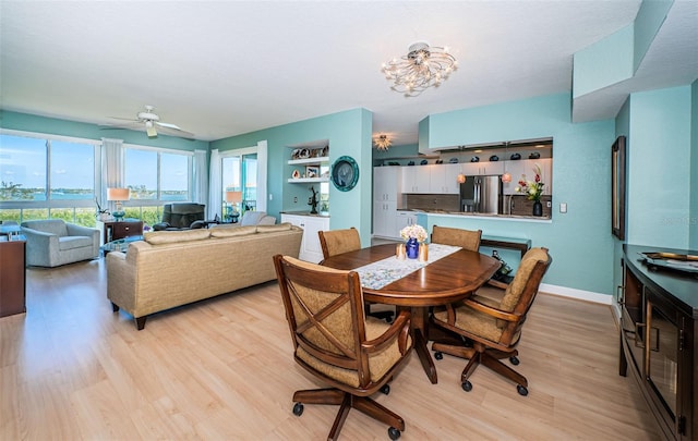 4801 Osprey Dr S Unit 508, Saint Petersburg, FL 33711 - dining space with baseboards, ceiling fan, and light wood-type flooring