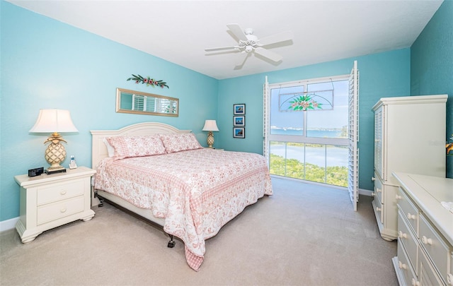 4801 Osprey Dr S Unit 508, Saint Petersburg, FL 33711 - bedroom with light carpet, baseboards, and ceiling fan