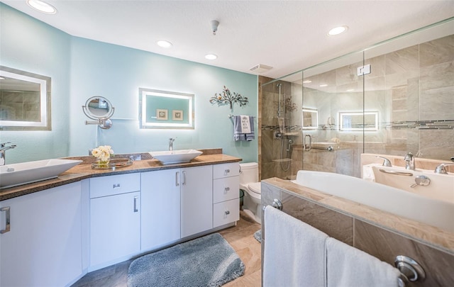 4801 Osprey Dr S Unit 508, Saint Petersburg, FL 33711 - bathroom featuring double vanity, a tile shower, a bathing tub, and a sink