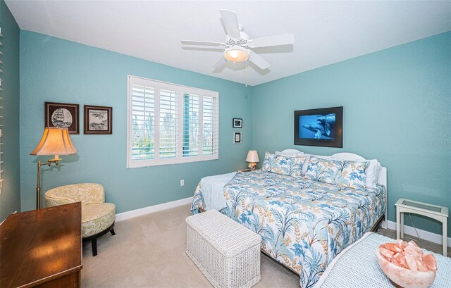 4801 Osprey Dr S Unit 508, Saint Petersburg, FL 33711 - carpeted bedroom with baseboards and ceiling fan