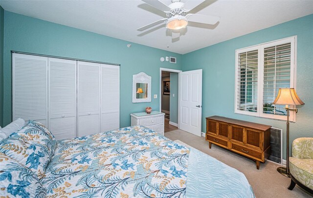 4801 Osprey Dr S Unit 508, Saint Petersburg, FL 33711 - carpeted bedroom featuring baseboards, a closet, and ceiling fan