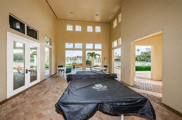 4801 Osprey Dr S Unit 508, Saint Petersburg, FL 33711 - sunroom with a water view, french doors, and a healthy amount of sunlight
