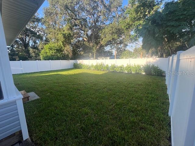 view of yard with a fenced backyard