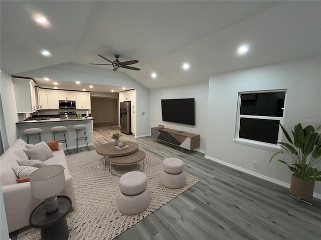 1574 Ewing Ave, Clearwater, FL 33756 - living area featuring wood finished floors, vaulted ceiling, a ceiling fan, baseboards, and recessed lighting