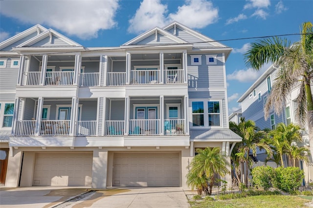 16306 1st St E, Redington Beach, FL 33708 - view of front of house with stucco siding, driveway, and a garage
