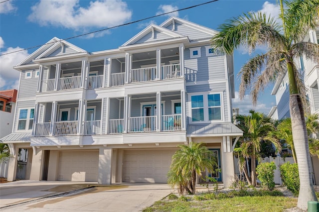 16306 1st St E, Redington Beach, FL 33708 - view of front of home featuring stucco siding, an attached garage, and concrete driveway