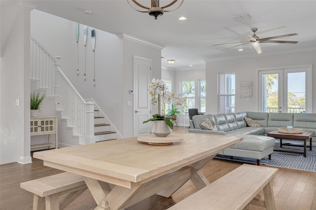 16306 1st St E, Redington Beach, FL 33708 - living area featuring a wealth of natural light, crown molding, stairway, and wood-type flooring