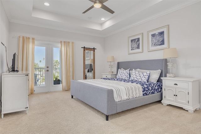 16306 1st St E, Redington Beach, FL 33708 - bedroom with crown molding, access to outside, a barn door, a tray ceiling, and light colored carpet