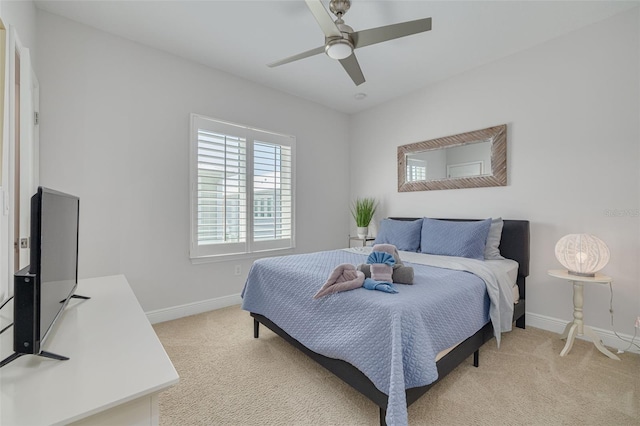 16306 1st St E, Redington Beach, FL 33708 - bedroom featuring a ceiling fan, light carpet, and baseboards