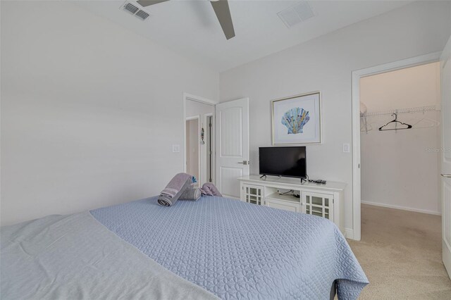16306 1st St E, Redington Beach, FL 33708 - bedroom with a spacious closet, a ceiling fan, light carpet, and visible vents