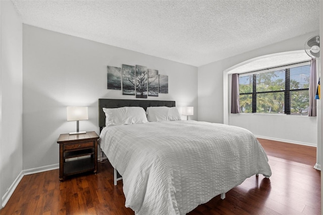 1998 Blue Hawk Ct Unit 1613, Clearwater, FL 33762 - bedroom with wood finished floors, a textured ceiling, and baseboards