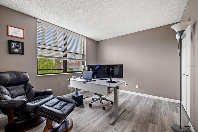 1998 Blue Hawk Ct Unit 1613, Clearwater, FL 33762 - office featuring wood finished floors, a textured ceiling, and baseboards
