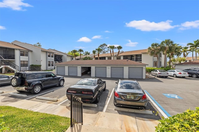 1998 Blue Hawk Ct Unit 1613, Clearwater, FL 33762 - view of front of house with community garages, uncovered parking, and a residential view