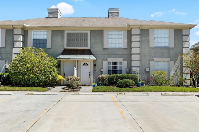 14019 Notreville Way, Tampa, FL 33624 - view of property with uncovered parking