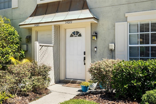 14019 Notreville Way, Tampa, FL 33624 - entrance to property with stucco siding