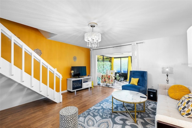 14019 Notreville Way, Tampa, FL 33624 - living area with stairs, wood finished floors, and a chandelier