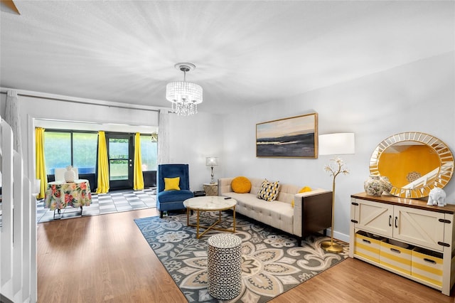 14019 Notreville Way, Tampa, FL 33624 - living area featuring baseboards, wood finished floors, and an inviting chandelier