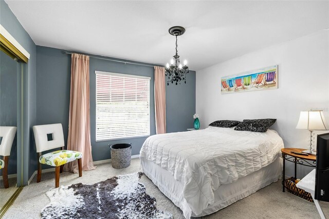 14019 Notreville Way, Tampa, FL 33624 - bedroom featuring baseboards, a closet, carpet, and a chandelier