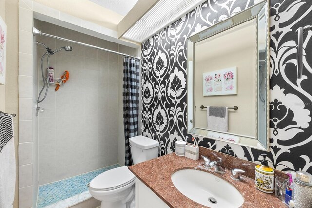 14019 Notreville Way, Tampa, FL 33624 - full bath with a tile shower, toilet, and vanity