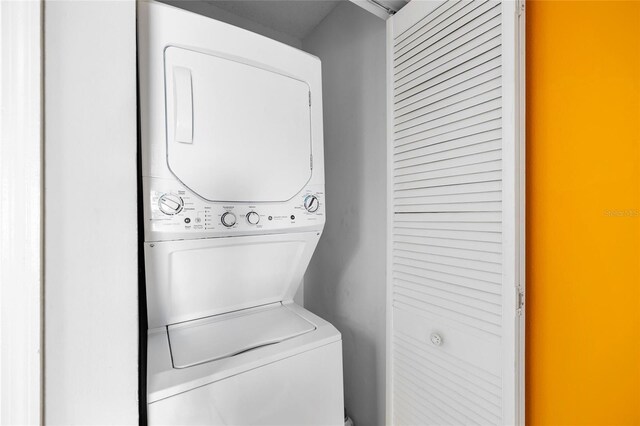 14019 Notreville Way, Tampa, FL 33624 - laundry room with stacked washer / dryer and laundry area