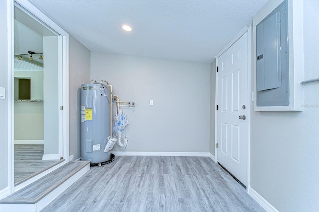 804 Shore Dr W, Oldsmar, FL 34677 - utility room with electric panel and electric water heater