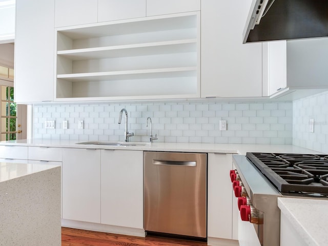 kitchen with dishwasher, open shelves, a sink, and under cabinet range hood